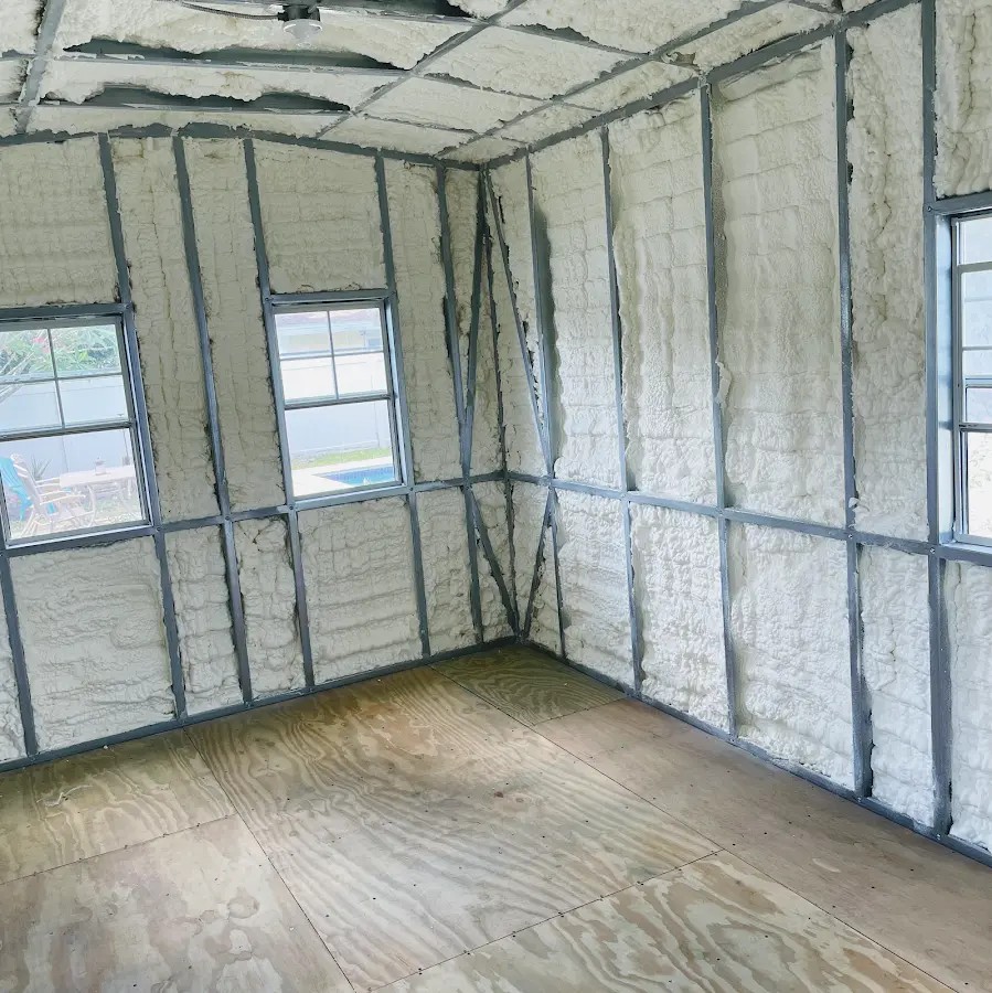 Closed-cell spray foam insulation applied to wall cavities in a residential project in Briarcliff Manor